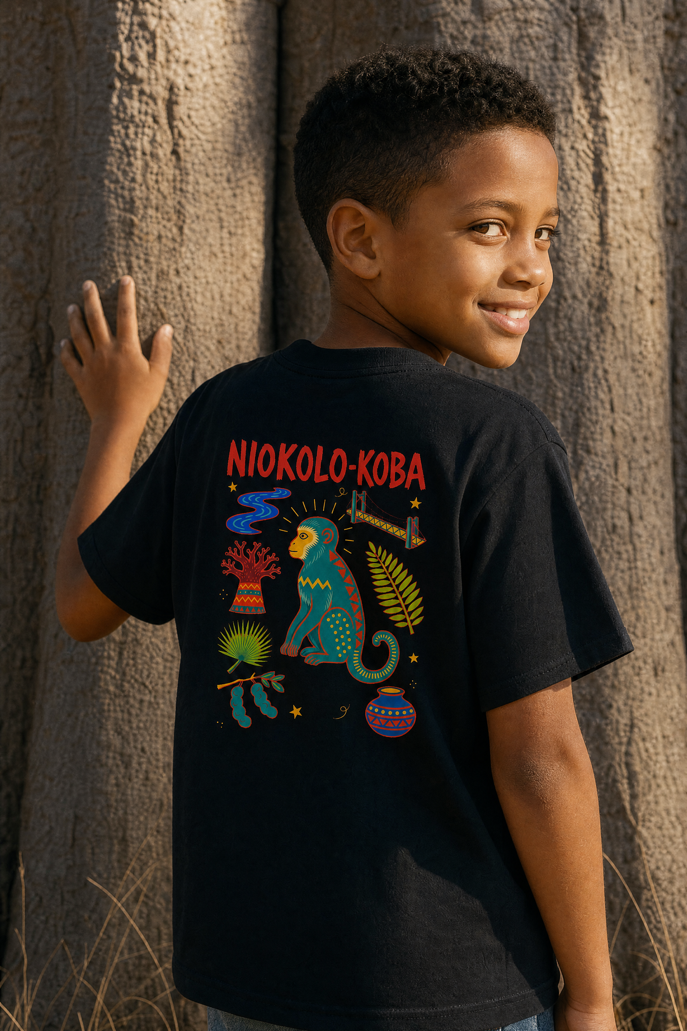 Niokolo-Koba Back Print Kids Tee — portée de dos, photoshoot, sur place